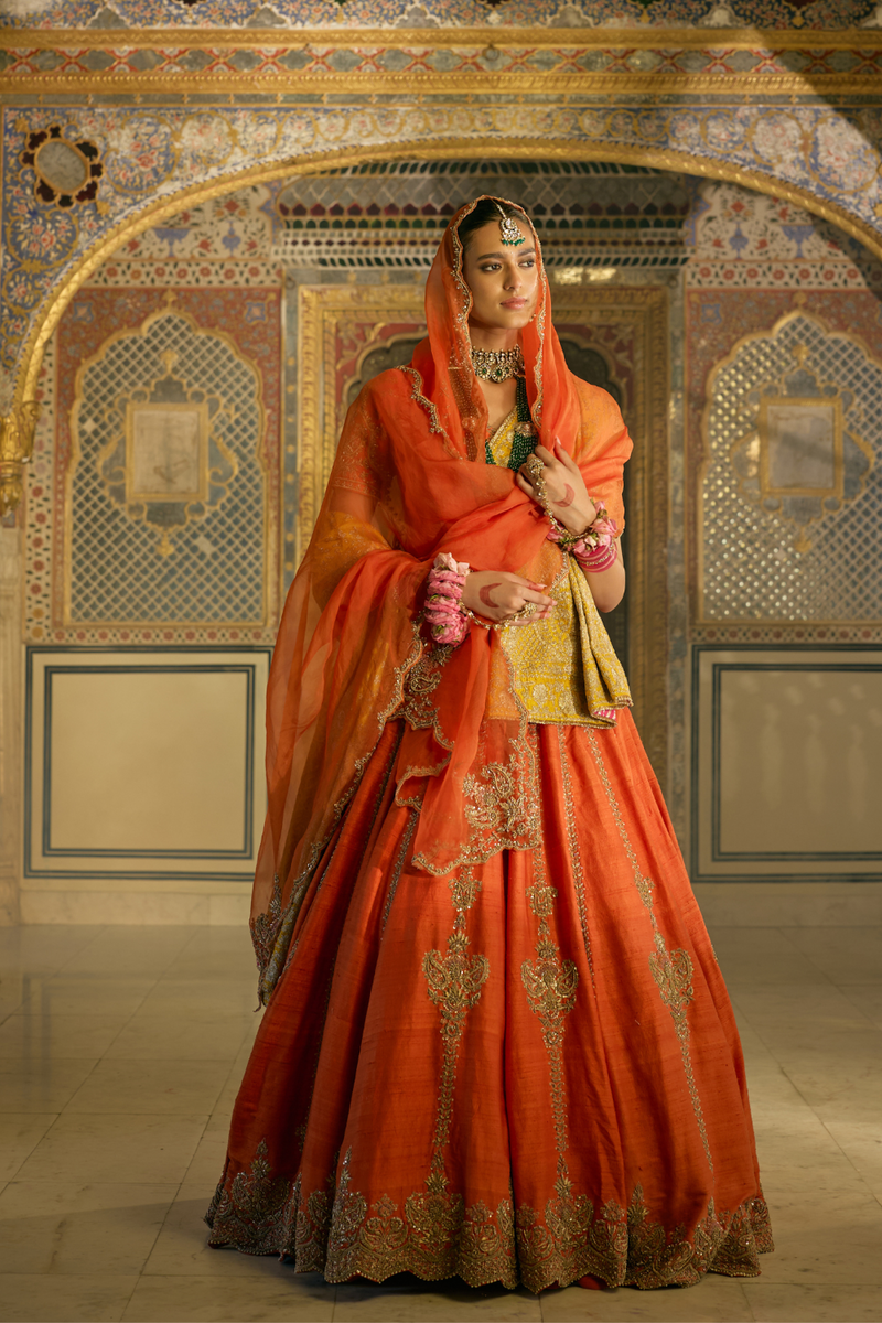 Naazila - Dabka Zardozi Embroidered Raw Silk Burnt Orange Lehenga Set silk by SHEETAL BATRA in orange color for women Worldwide