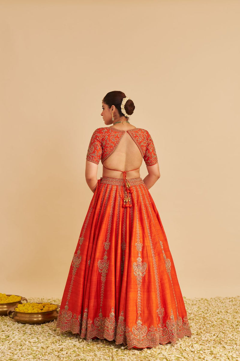 Naazila - Dabka Zardozi Embroidered Raw Silk Burnt Orange Lehenga Set silk by SHEETAL BATRA in orange color for women Worldwide