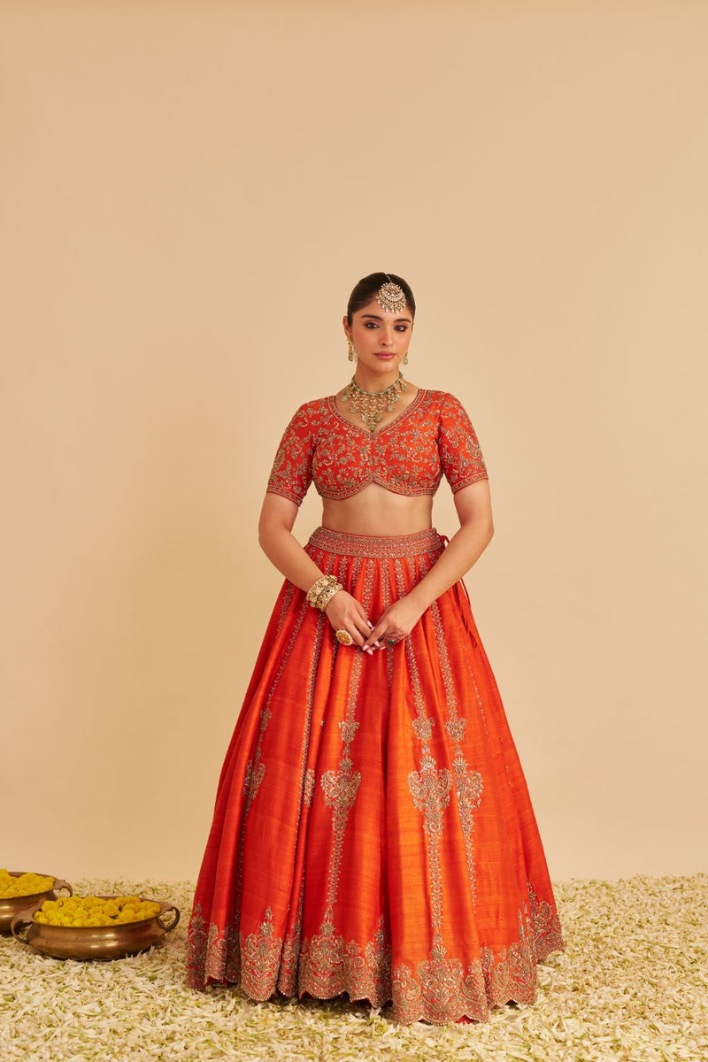 Naazila - Dabka Zardozi Embroidered Raw Silk Burnt Orange Lehenga Set silk by SHEETAL BATRA in orange color for women Worldwide