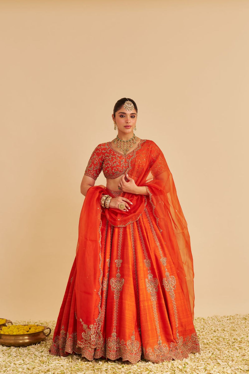 Naazila - Dabka Zardozi Embroidered Raw Silk Burnt Orange Lehenga Set silk by SHEETAL BATRA in orange color for women Worldwide