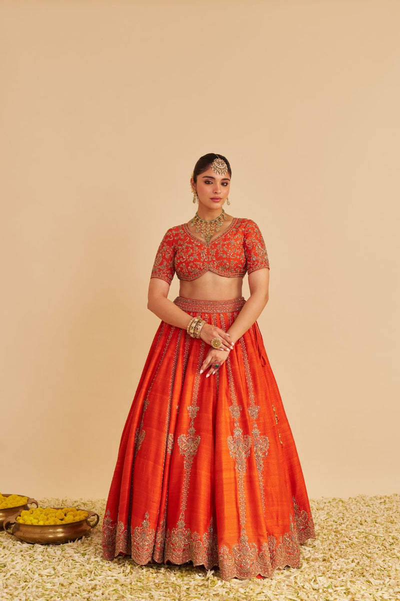 Naazila - Dabka Zardozi Embroidered Raw Silk Burnt Orange Lehenga Set silk by SHEETAL BATRA in orange color for women Worldwide