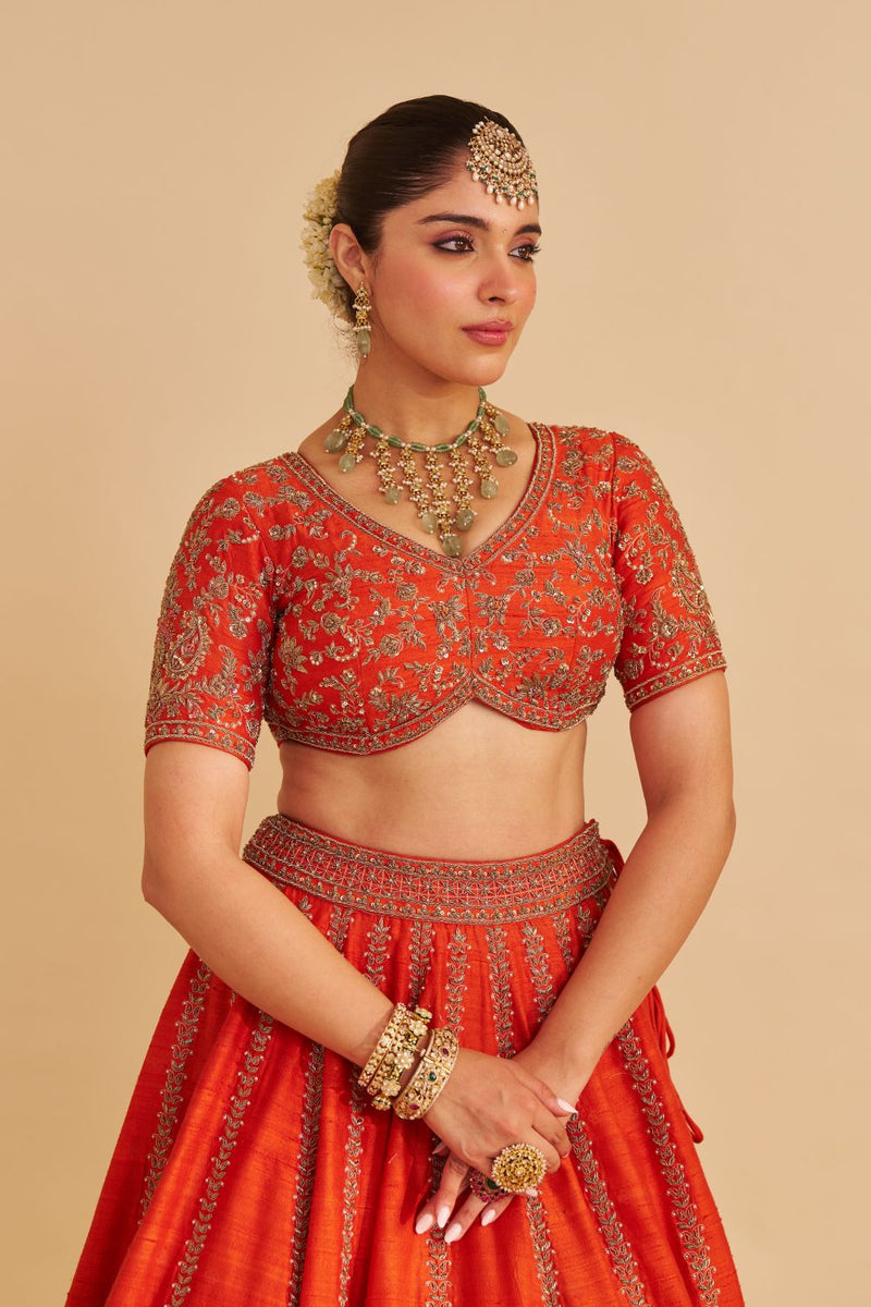Naazila - Dabka Zardozi Embroidered Raw Silk Burnt Orange Lehenga Set silk by SHEETAL BATRA in orange color for women Worldwide