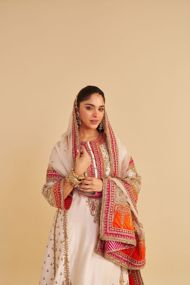 Nargis - Dabka Zardozi Embroidered Rich Banarasi Kalidaar Daisy Ivory Long Chauga Set satin by SHEETAL BATRA in ivory color for women Worldwide