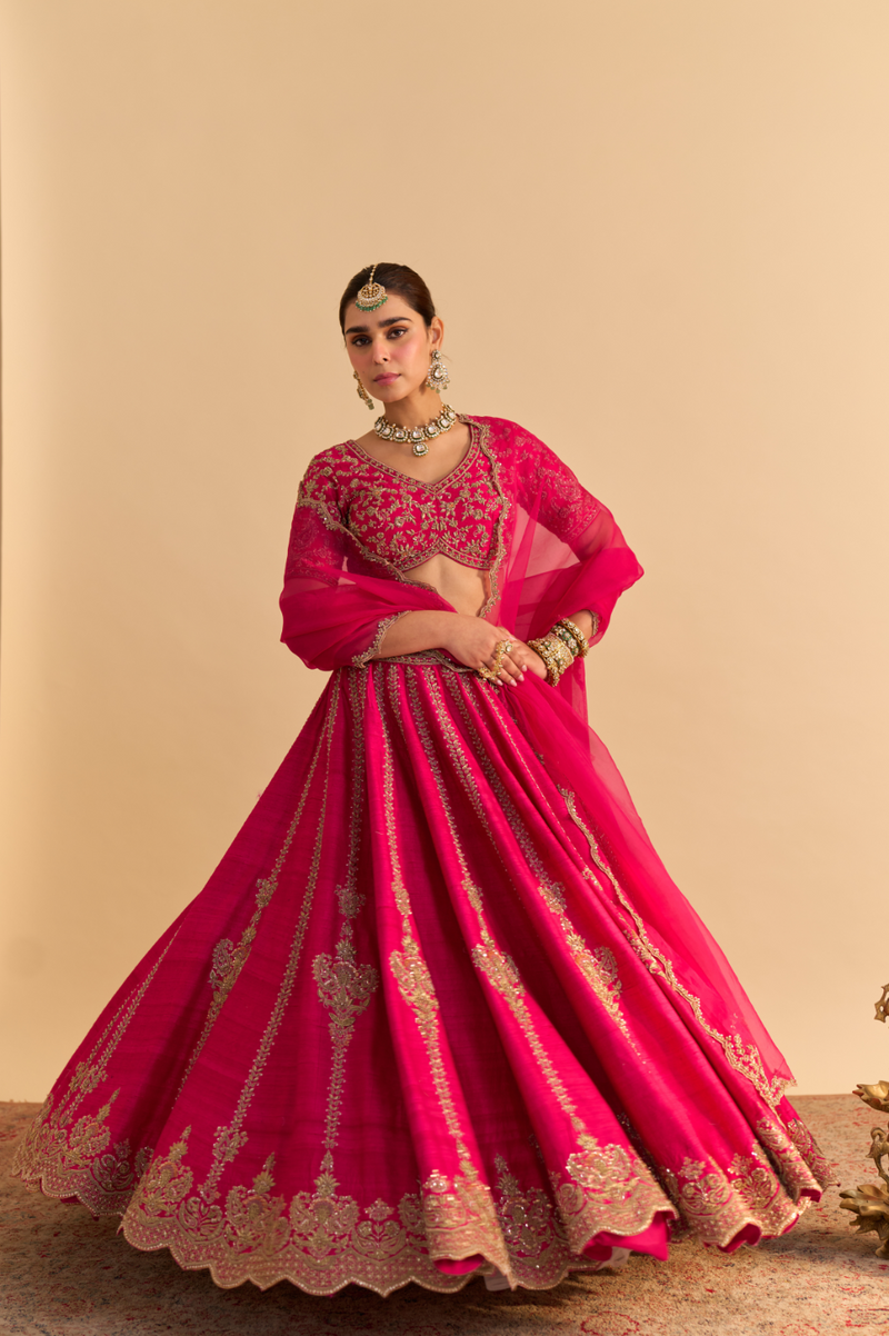 Naazila - Dabka Zardozi Embroidered Raw Silk Hotpink Lehenga Set by SHEETAL BATRA in pink color for women Worldwide