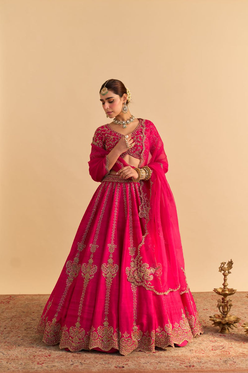 Naazila - Dabka Zardozi Embroidered Raw Silk Hotpink Lehenga Set by SHEETAL BATRA in pink color for women Worldwide