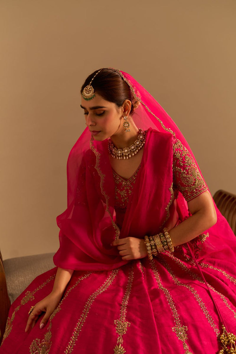 Naazila - Dabka Zardozi Embroidered Raw Silk Hotpink Lehenga Set by SHEETAL BATRA in pink color for women Worldwide