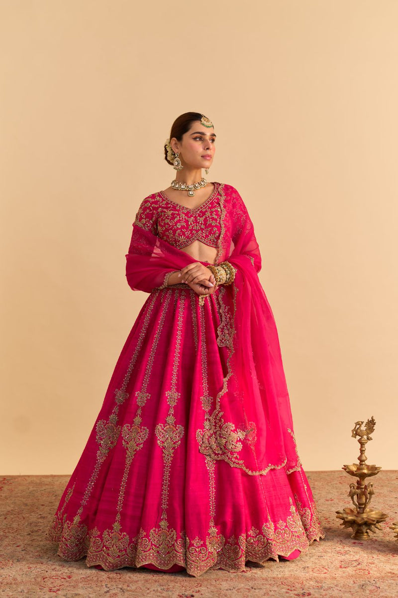 Naazila - Dabka Zardozi Embroidered Raw Silk Hotpink Lehenga Set by SHEETAL BATRA in pink color for women Worldwide