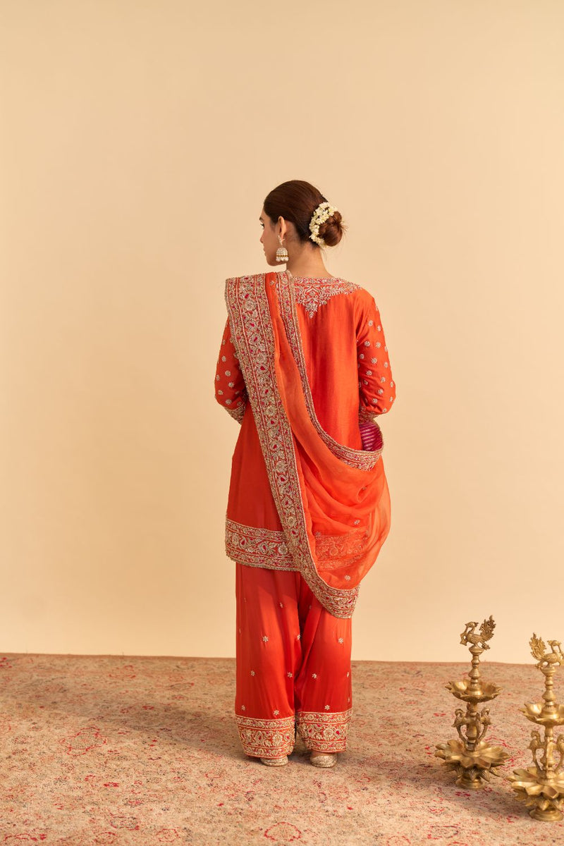 Naseha Burnt orange Dabka Zardozi Embroidered Short kurta Set by SHEETAL BATRA in orange color for women Worldwide