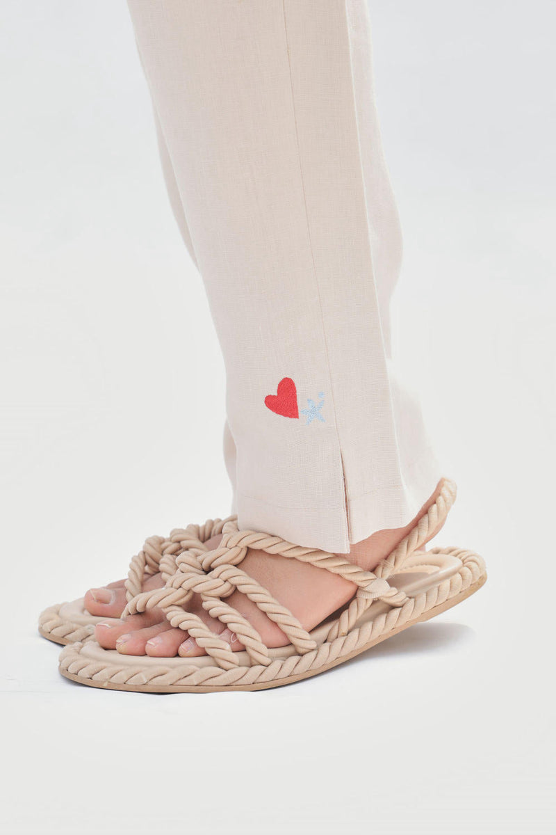 Ocean Breeze Linen Trousers by SUI in white color for women Worldwide