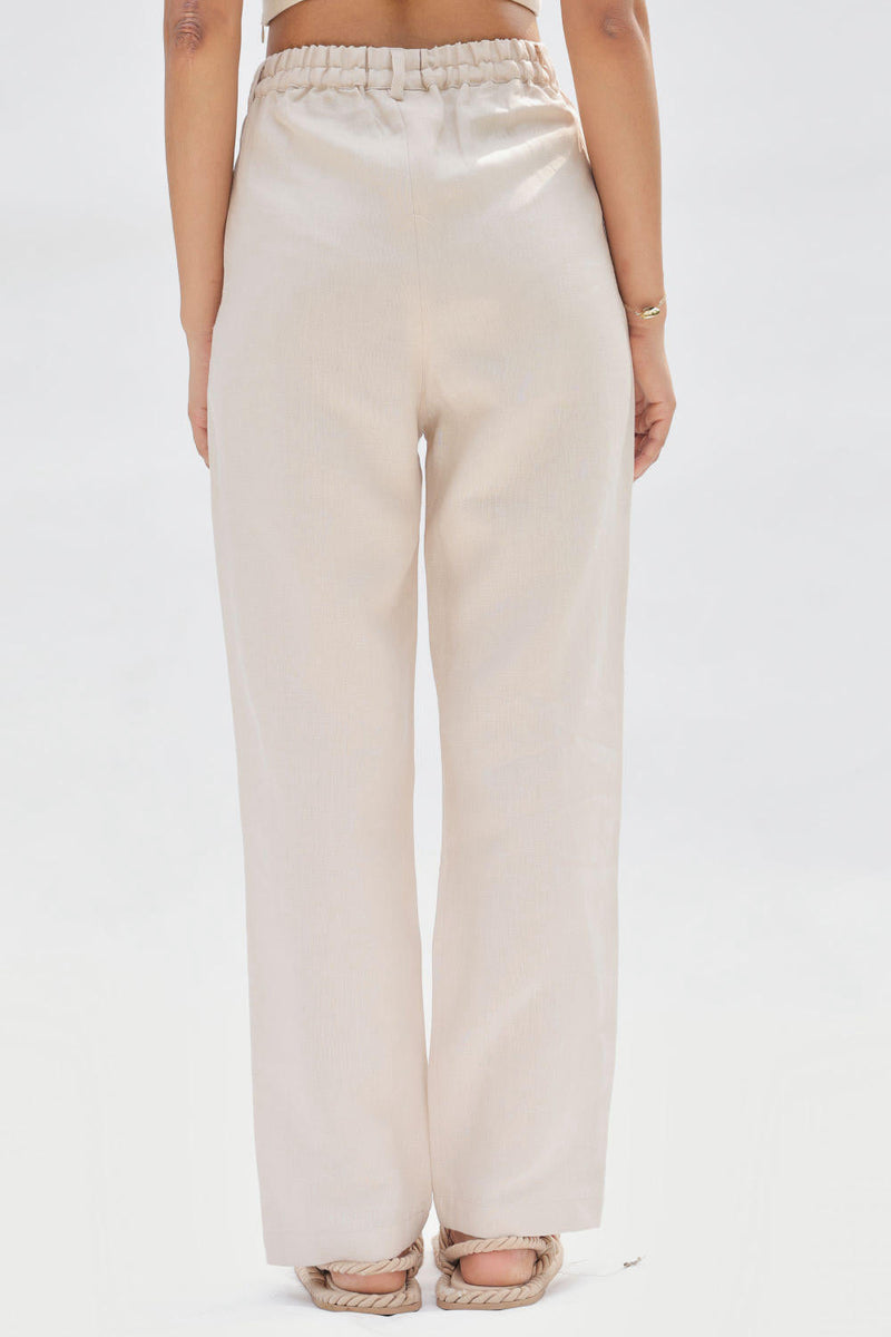 Ocean Breeze Linen Trousers by SUI in white color for women Worldwide