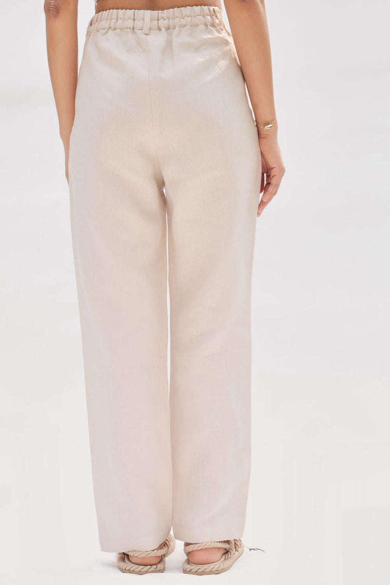 Ocean Breeze Linen Trousers by SUI in white color for women Worldwide