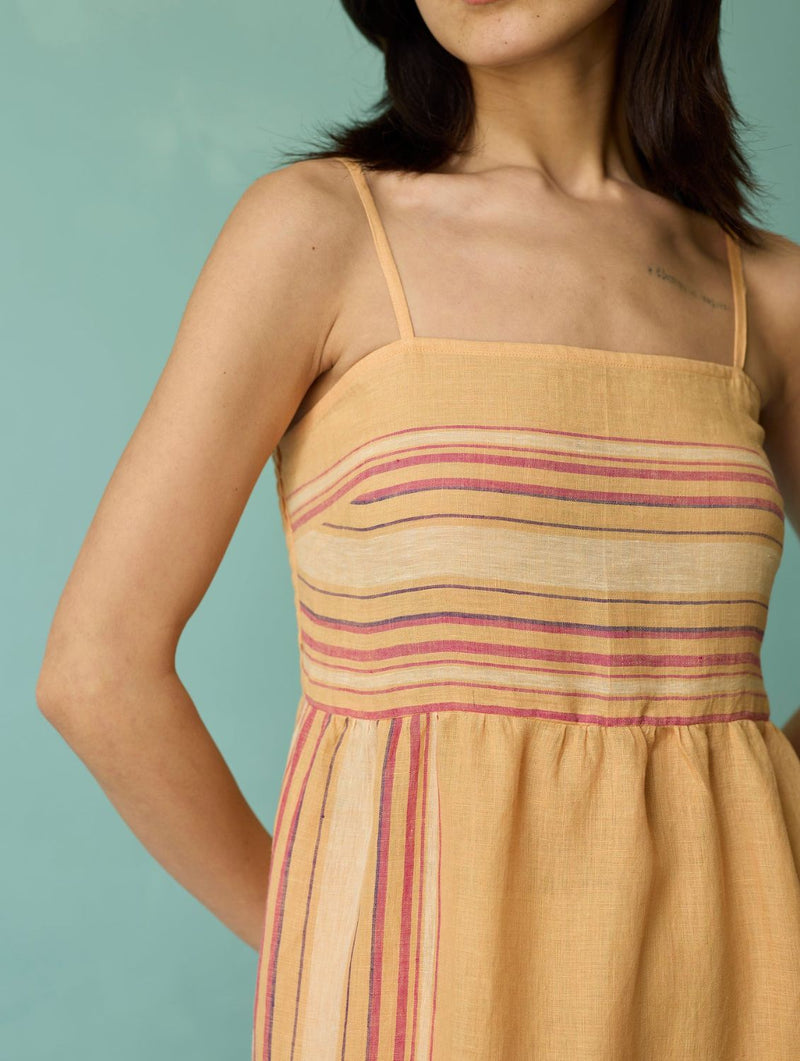 Pera Border Linen Tiered Dress - Apricot linen dress by Manan in apricot for women Worldwide