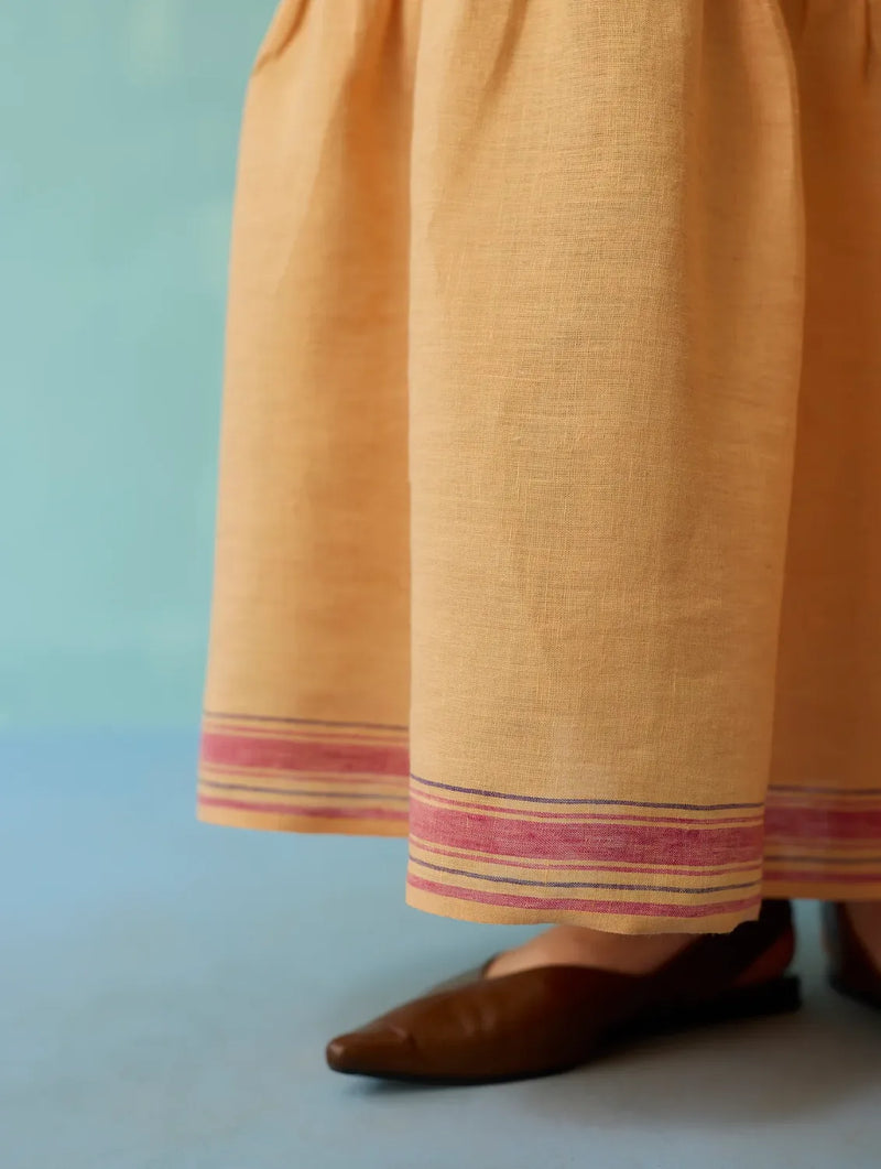 Pera Border Linen Tiered Dress - Apricot linen dress by Manan in apricot for women Worldwide
