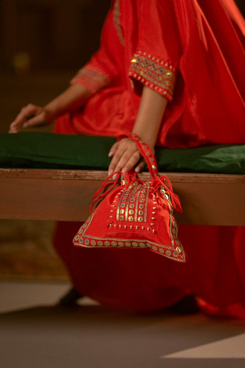 Ramani Red Chamak Potli- Red silk by PRAHNAAYA in red color for women Worldwide