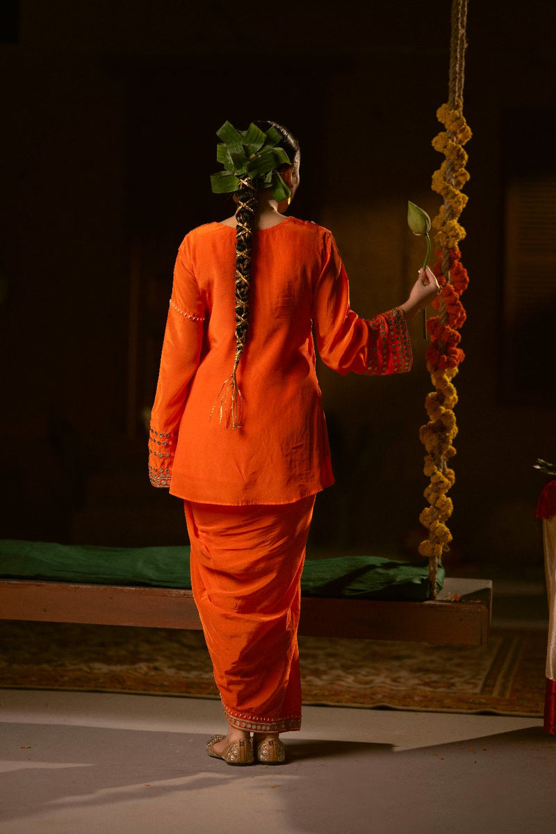 Mangala Tunic Jacket with pleated skirt- Orange silk by PRAHNAAYA in orange color for women Worldwide