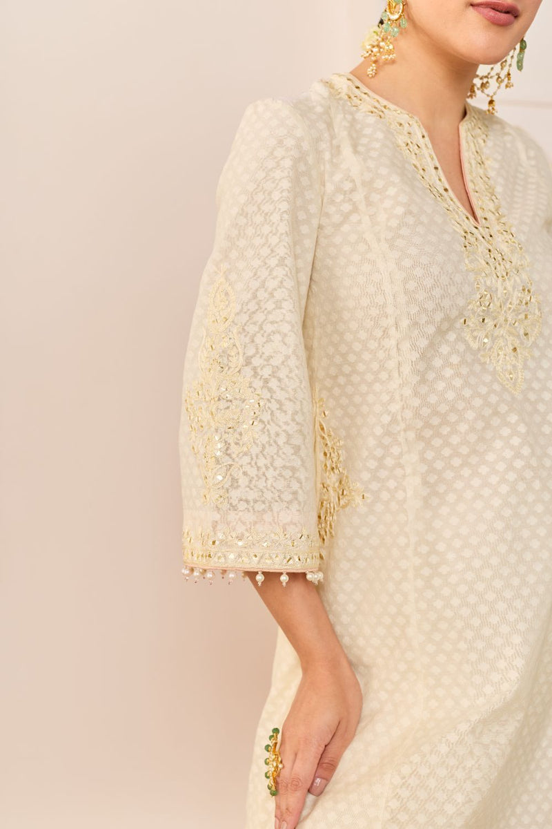 REEM - DAISY IVORY SHORT CHOGA WITH DOGRI SALWAR chanderi silk kurta/kurta set by SHEETAL BATRA in daisy iovry with carnation pink for women Worldwide