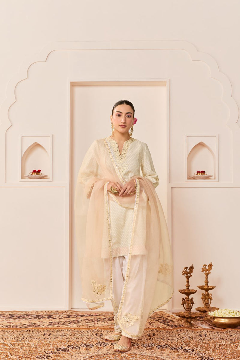 REEM - DAISY IVORY SHORT CHOGA WITH DOGRI SALWAR chanderi silk kurta/kurta set by SHEETAL BATRA in daisy iovry with carnation pink for women Worldwide