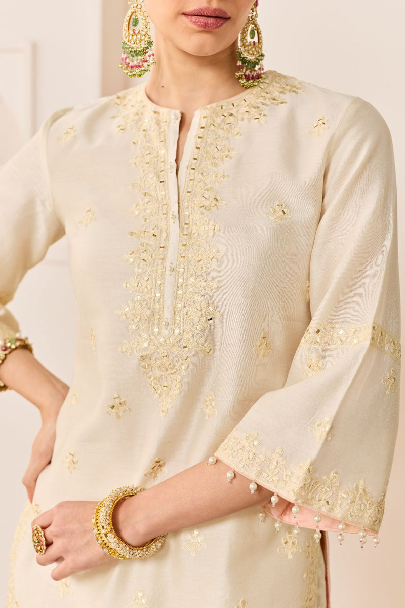 REHMA -DAISY IVORY SHORT KURTA WITH SHARARA AND DUPATTA chanderi silk kurta/kurta set by SHEETAL BATRA in daisy ivory with carnation pink for women Worldwide