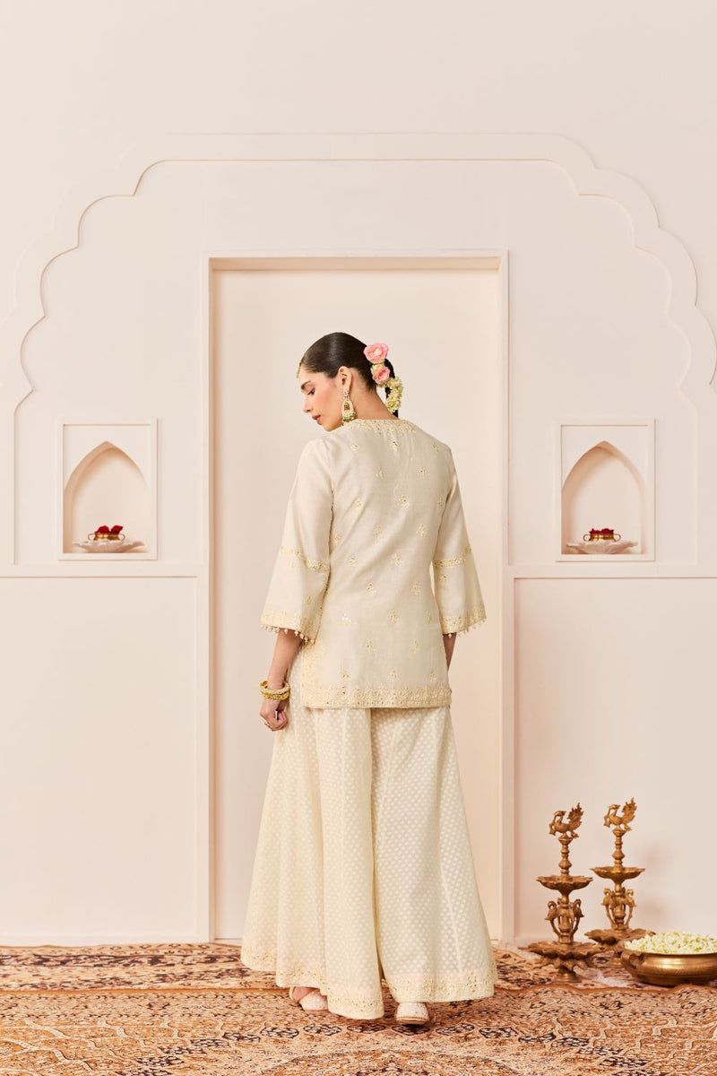REHMA -DAISY IVORY SHORT KURTA WITH SHARARA AND DUPATTA chanderi silk kurta/kurta set by SHEETAL BATRA in daisy ivory with carnation pink for women Worldwide