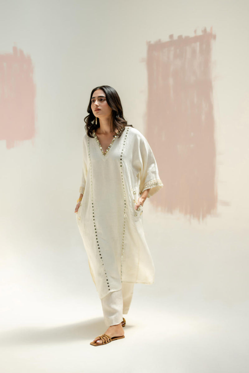 Aaram Choga Kurta with Pants-White linen by PRAHNAAYA in white color for women Worldwide