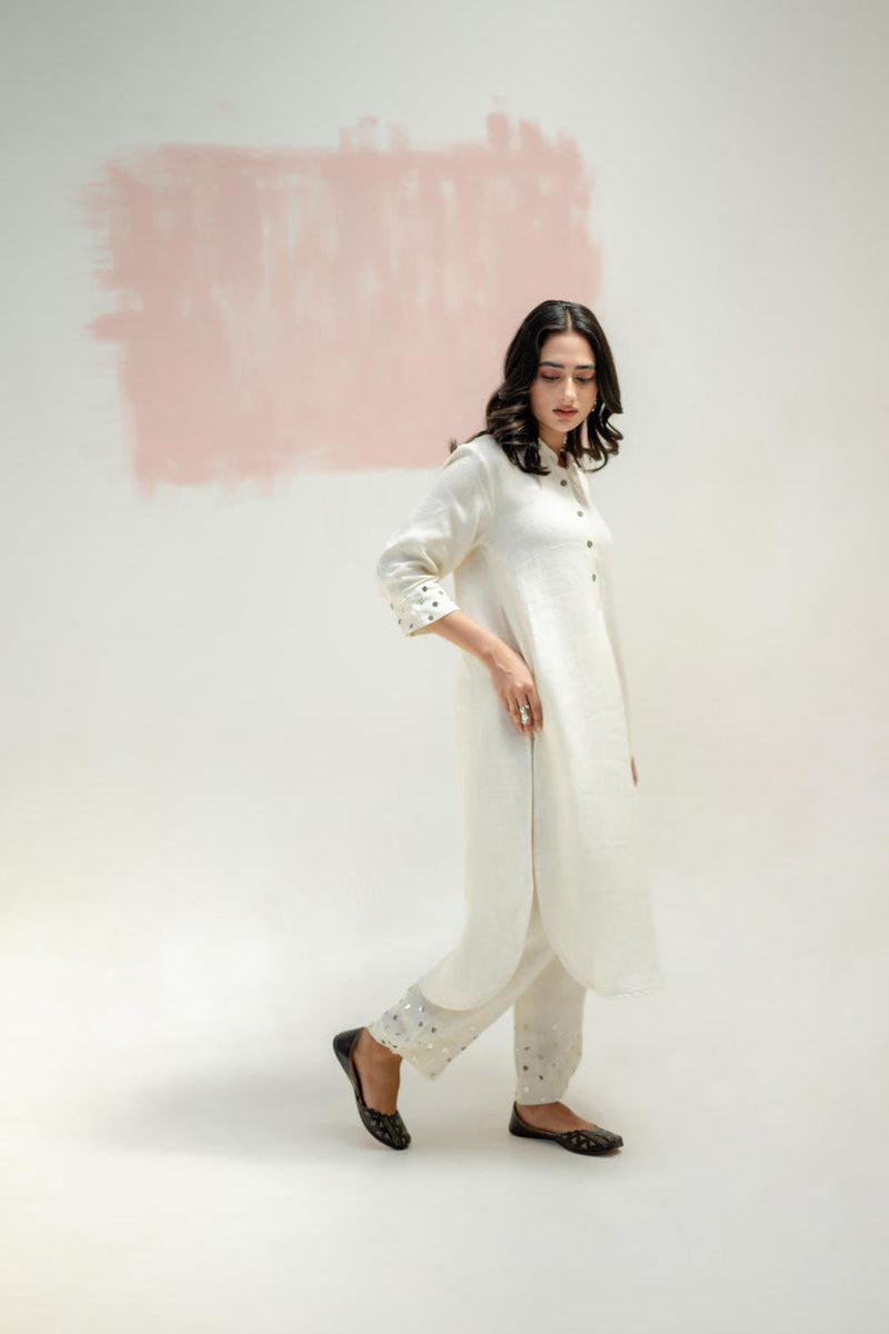 Mia Slim Kurta and Hand embroidered Pants-White linen by PRAHNAAYA in white color for women Worldwide