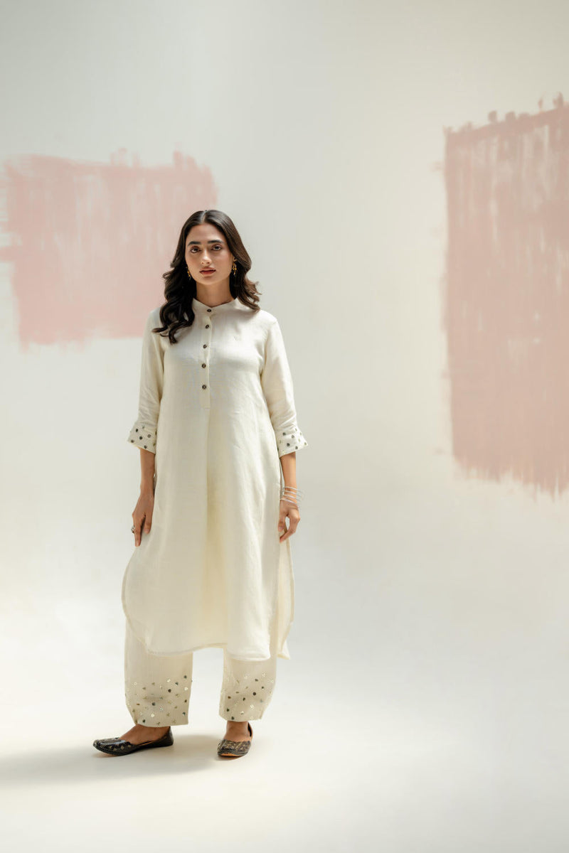 Mia Slim Kurta and Hand embroidered Pants-White linen by PRAHNAAYA in white color for women Worldwide