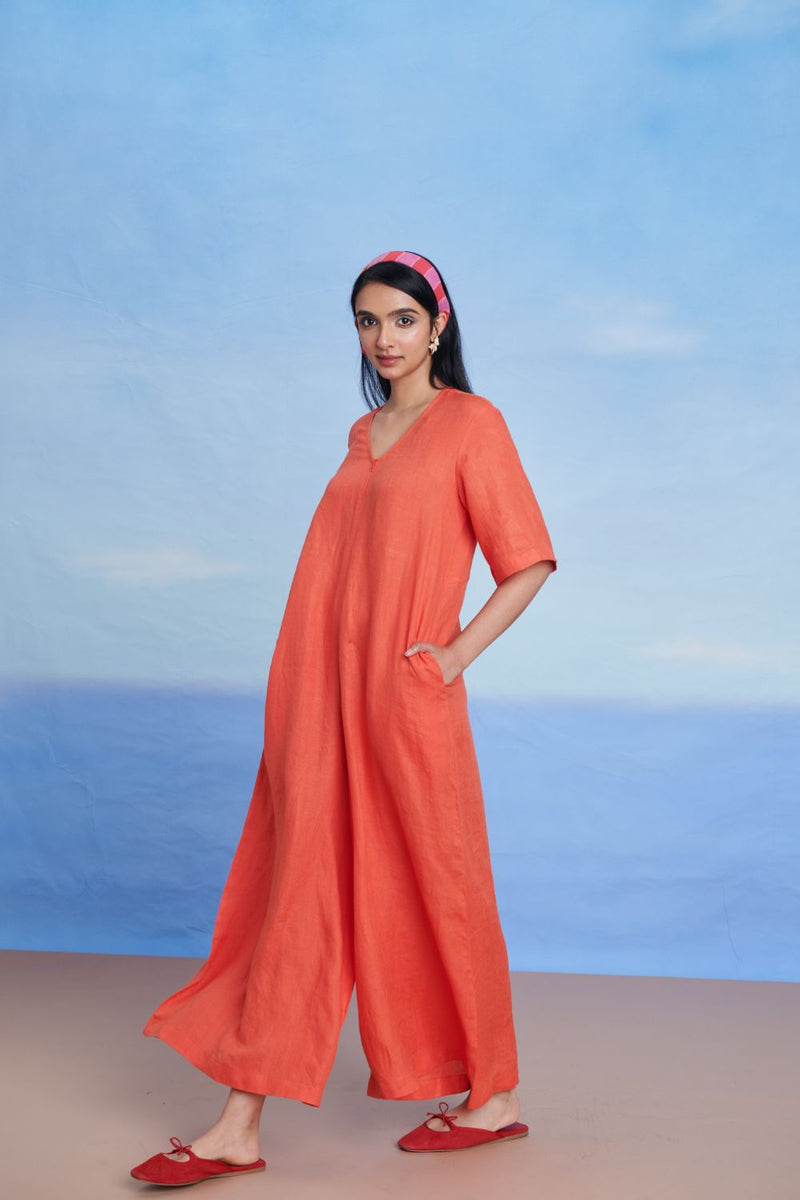 Tangerine Linen Half Sleeves Flared Jumpsuit linen by Saphed in orange color for women Worldwide