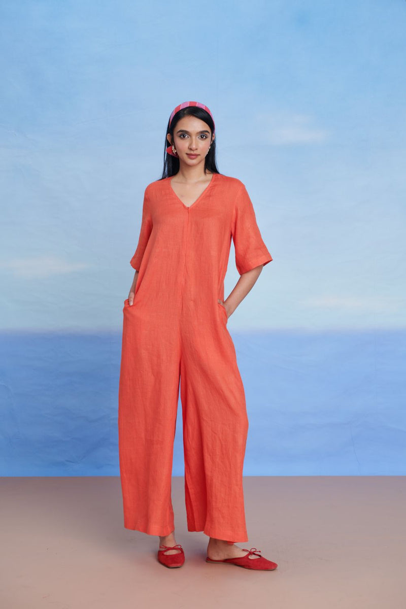 Tangerine Linen Half Sleeves Flared Jumpsuit linen by Saphed in orange color for women Worldwide