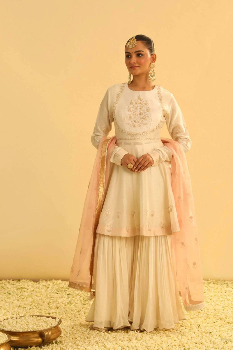 Shahana Peplum kurta with garara and dupatta-Daisy ivory silk by SHEETAL BATRA in ivory color for women Worldwide