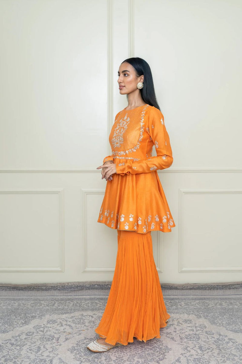 Shahana Peplum kurta with garara and dupatta-Pumpkin orange & scarlet red silk by SHEETAL BATRA in orange color for women Worldwide