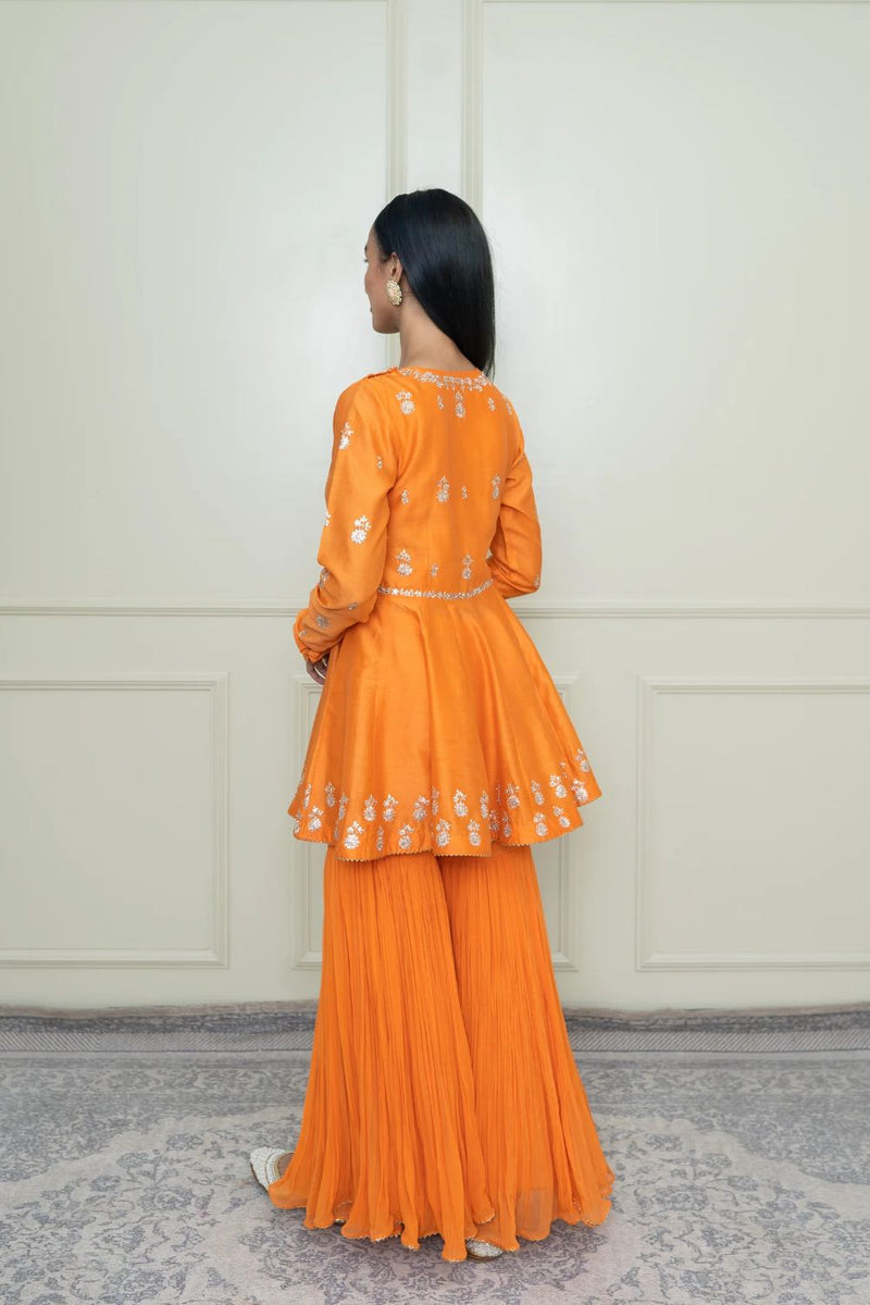 Shahana Peplum kurta with garara and dupatta-Pumpkin orange & scarlet red silk by SHEETAL BATRA in orange color for women Worldwide