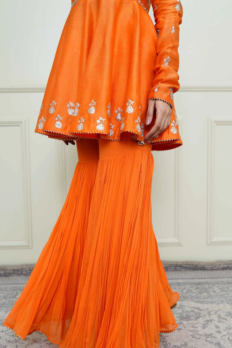 Shahana Peplum kurta with garara and dupatta-Pumpkin orange & scarlet red silk by SHEETAL BATRA in orange color for women Worldwide