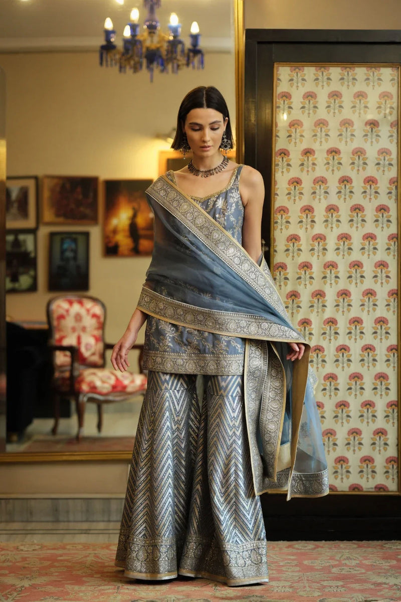 ‘Shama’ Banarasi munga silk chevron gharara georgette kurta/kurta set by Malika Mathur in blue grey for women Worldwide