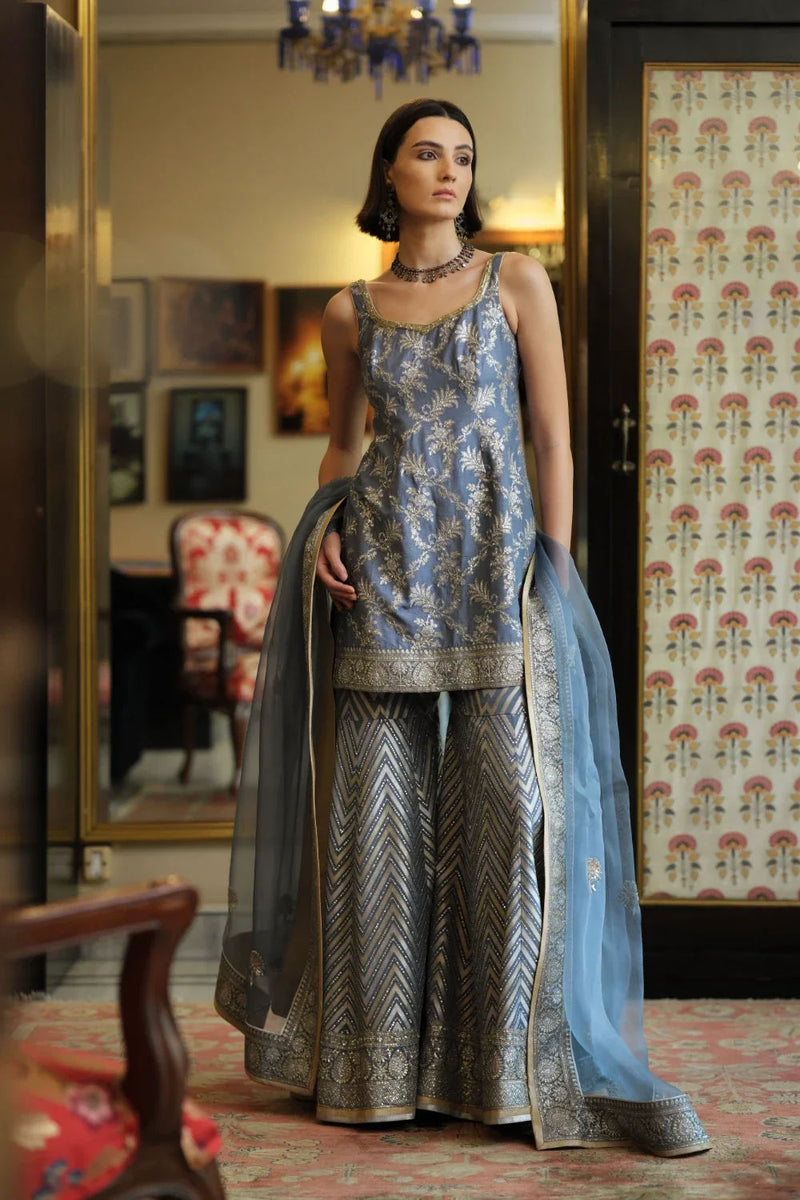 ‘Shama’ Banarasi munga silk chevron gharara georgette kurta/kurta set by Malika Mathur in blue grey for women Worldwide