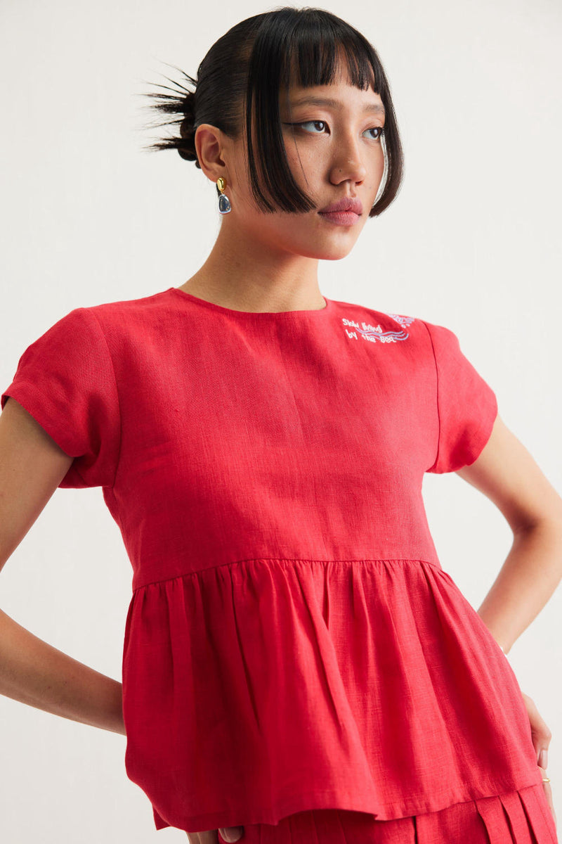 Slow Living Linen Peplum Top by SUI in red color for women Worldwide