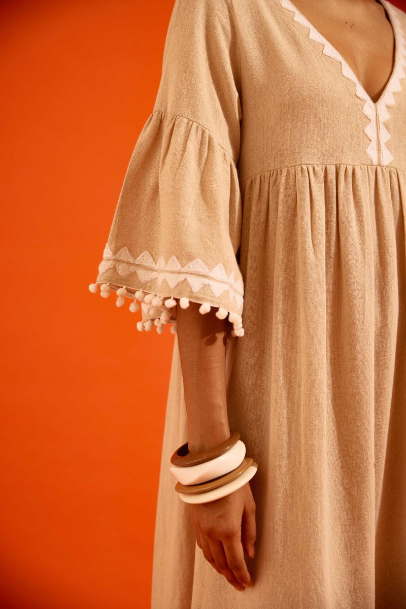 Natural Jute Maxi Dress With Ivory Petal Thread Embroidery by Indian Summer Story in beige color for women Worldwide