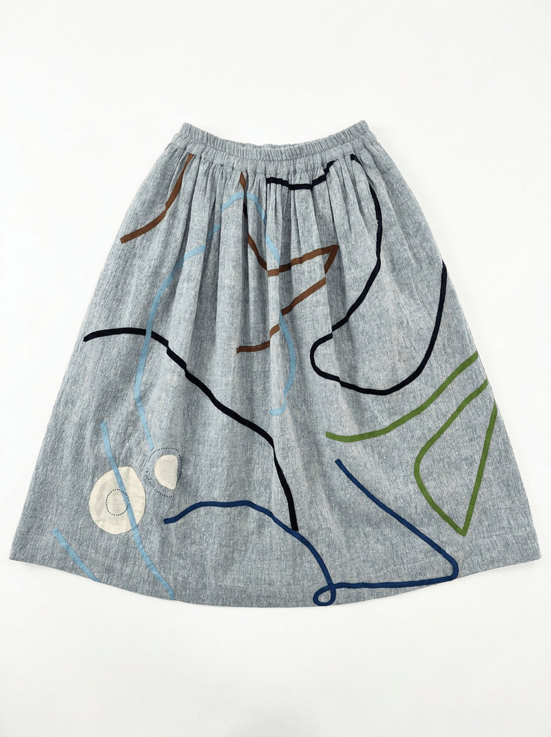 The Crayon Joy Skirt handwoven organic chambray cotton skirt by World of Crow in light blue indigo for women Worldwide