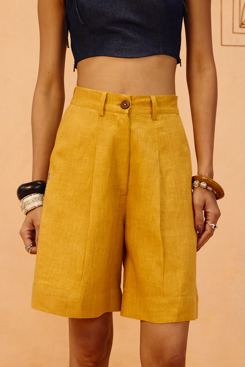 The Golden Linen Shorts 100% linen short by SUI in mustard for women Worldwide
