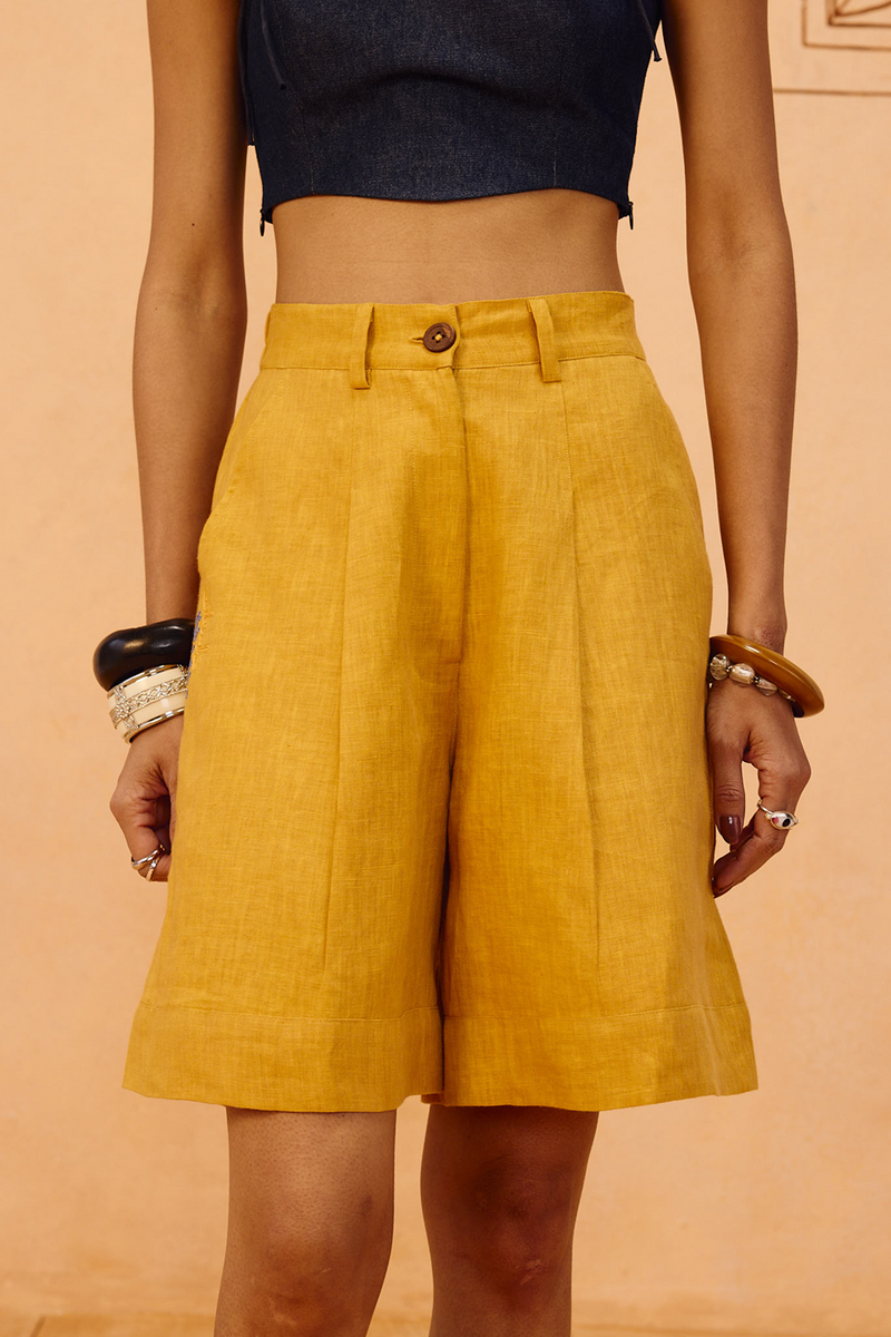 The Golden Linen Shorts 100% linen short by SUI in mustard for women Worldwide