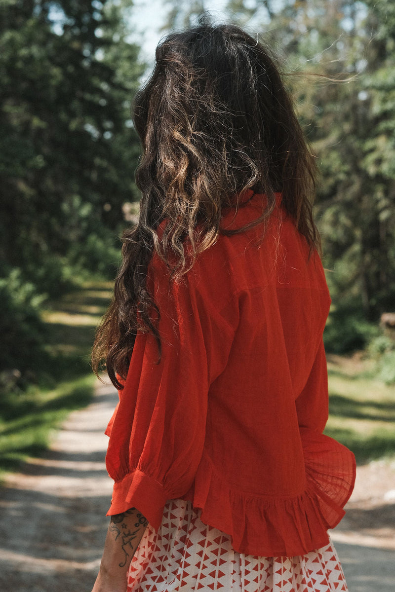 The Scarlet Frill Top by World of Crow in orange color for women Worldwide