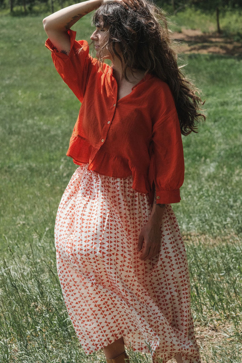 The Scarlet Frill Top by World of Crow in orange color for women Worldwide