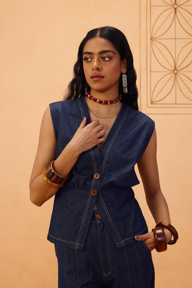 The Timeless Sustainable Denim Waistcoat denim jacket/overlay by SUI in blue for women Worldwide