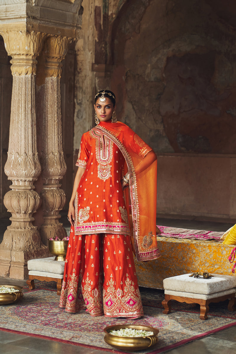 AREESHA - BURNT ORANGE SHORT KURTA WITH SHARARA AND DUPATTA silk chanderi kurta/kurta set by SHEETAL BATRA in orange for women Worldwide