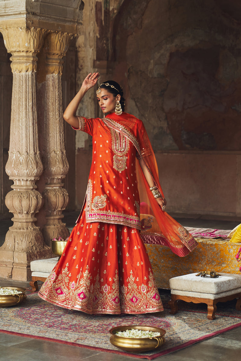 AREESHA - BURNT ORANGE SHORT KURTA WITH SHARARA AND DUPATTA silk chanderi kurta/kurta set by SHEETAL BATRA in orange for women Worldwide