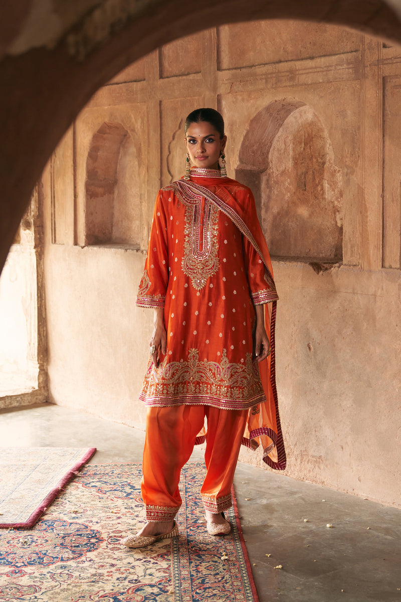 FARHANA - BURNT ORANGE SHORT KURTA WITH SALWAR AND DUPATTA chanderi silk kurta/kurta set by SHEETAL BATRA in orange for women Worldwide