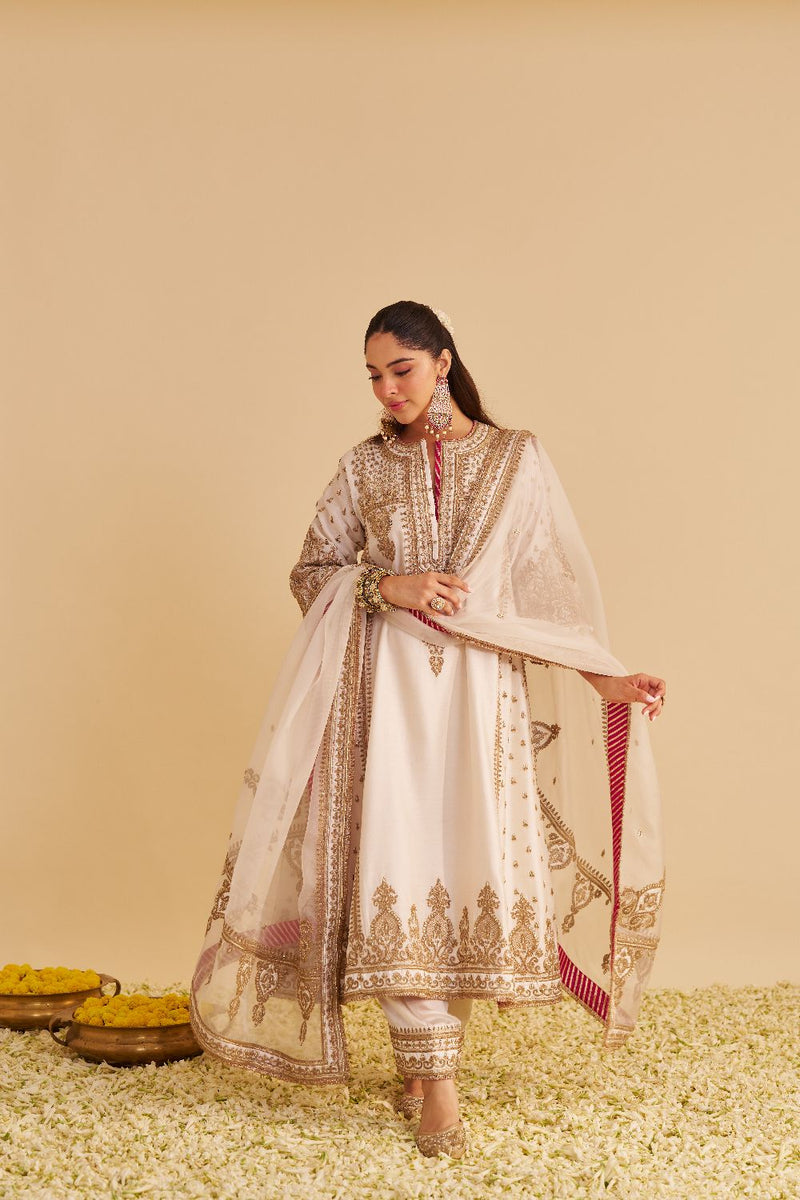 Zoya - Dabka Zardozi Embroidered Rich Banarasi Kalidaar Daisy Ivory Long Chauga Set satin by SHEETAL BATRA in ivory color for women Worldwide