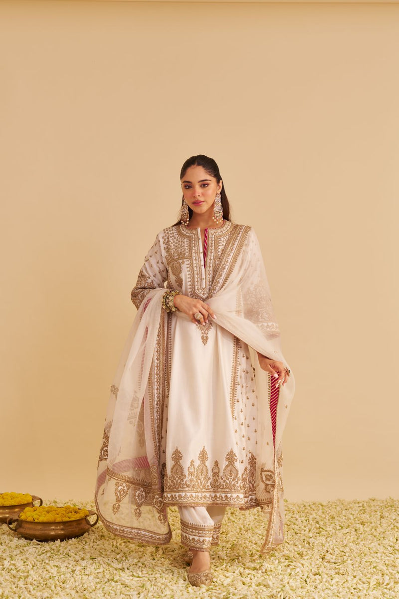 Zoya - Dabka Zardozi Embroidered Rich Banarasi Kalidaar Daisy Ivory Long Chauga Set satin by SHEETAL BATRA in ivory color for women Worldwide