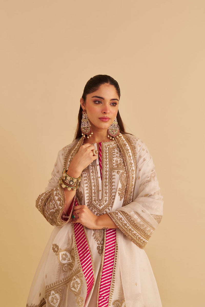 Zoya - Dabka Zardozi Embroidered Rich Banarasi Kalidaar Daisy Ivory Long Chauga Set satin by SHEETAL BATRA in ivory color for women Worldwide