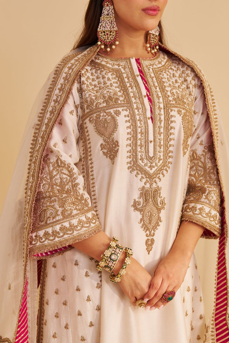 Zoya - Dabka Zardozi Embroidered Rich Banarasi Kalidaar Daisy Ivory Long Chauga Set satin by SHEETAL BATRA in ivory color for women Worldwide