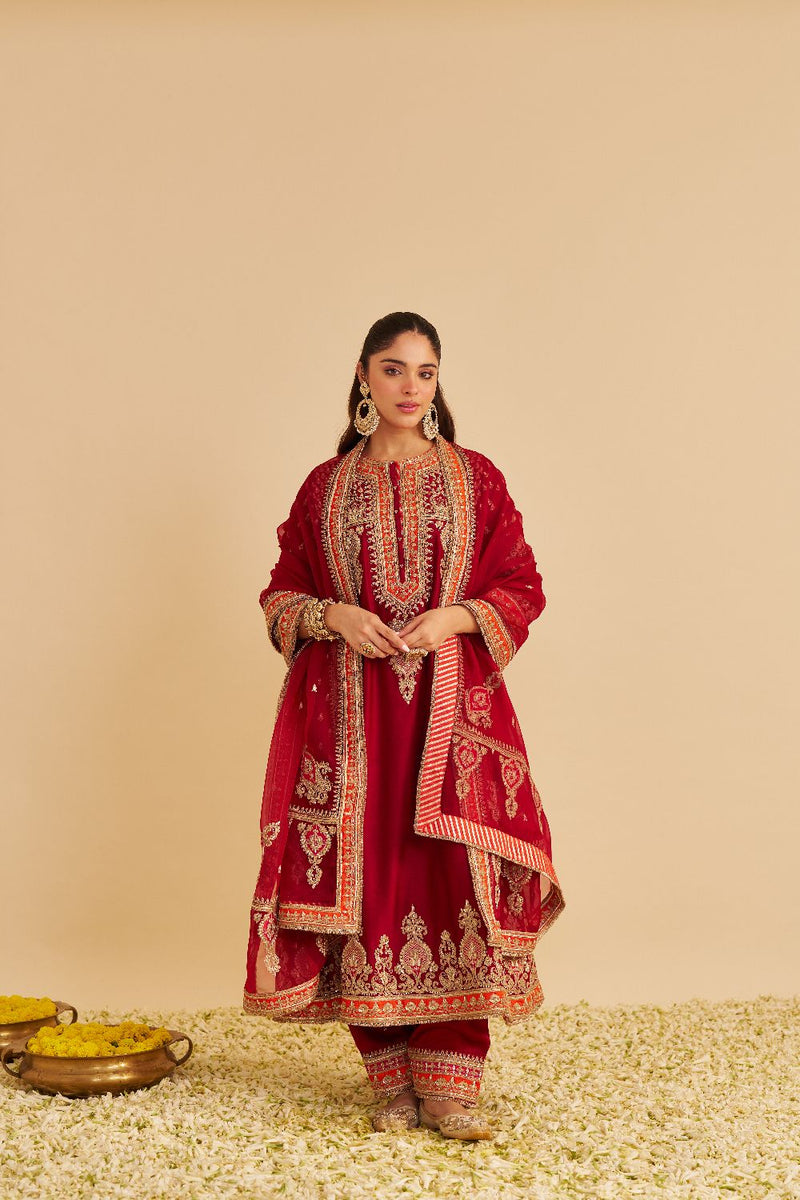 Zoya - Dabka Zardozi Embroidered Rich Banarasi Kalidaar Deep Red Long Chauga Set satin by SHEETAL BATRA in red color for women Worldwide